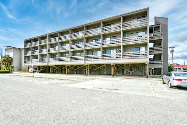 view of property with uncovered parking