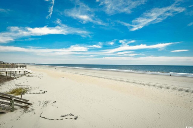 property view of water featuring a beach view