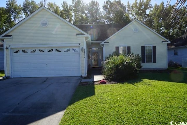 ranch-style house with a garage and a front lawn