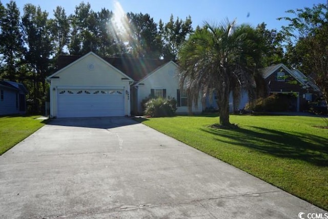 ranch-style home featuring a garage and a front yard