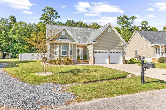 view of front of property with a garage and a front lawn