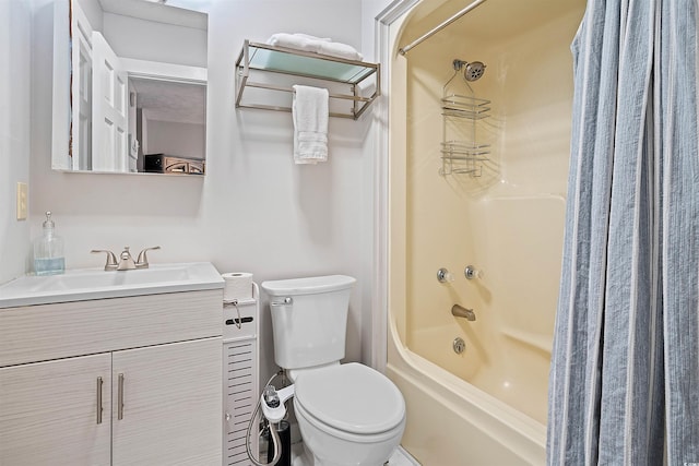 full bathroom with vanity, shower / bath combo, and toilet