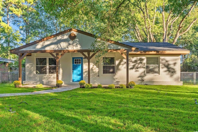 view of front of property with a porch and a front yard