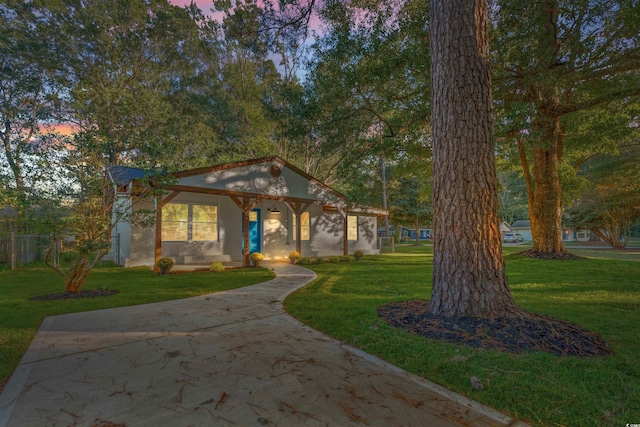 view of front of house featuring a yard and a porch