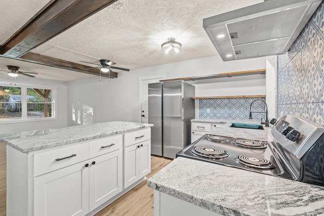 kitchen featuring white cabinets, light hardwood / wood-style flooring, ventilation hood, appliances with stainless steel finishes, and light stone countertops