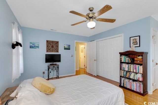 bedroom featuring a closet, ceiling fan, and light hardwood / wood-style floors