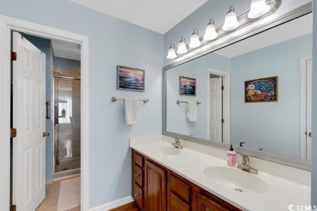 bathroom featuring vanity, tile patterned floors, and an enclosed shower