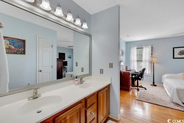 bathroom with vanity and hardwood / wood-style flooring