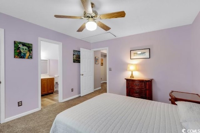 bedroom featuring light colored carpet, connected bathroom, and ceiling fan