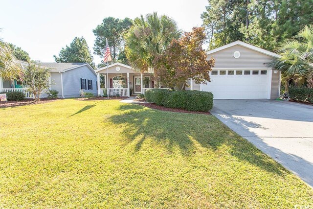 single story home featuring covered porch, a front yard, and a garage