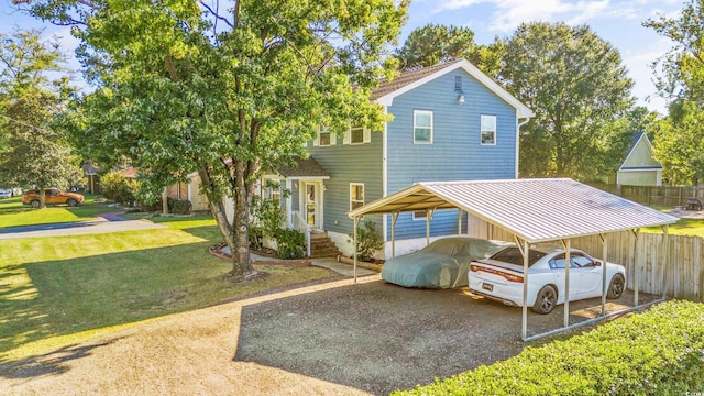 view of front facade with a front lawn and a carport