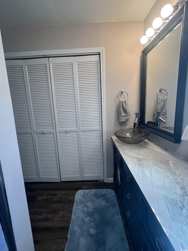 bathroom featuring hardwood / wood-style flooring and vanity