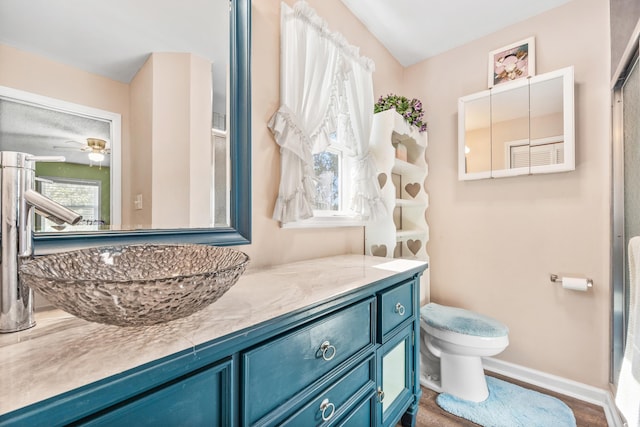 bathroom featuring vanity and toilet