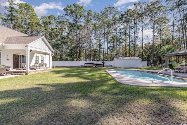 view of yard featuring a gazebo, a patio area, and a fenced in pool