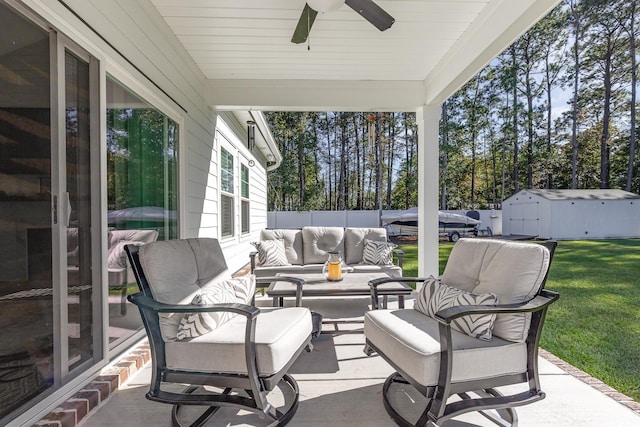 view of patio / terrace featuring a storage unit, an outdoor living space, and ceiling fan