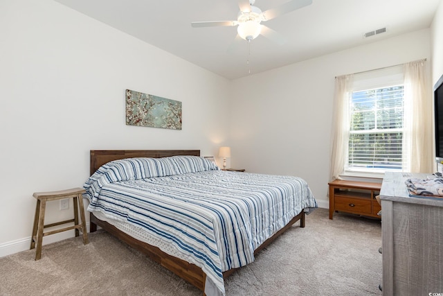 bedroom with light carpet and ceiling fan