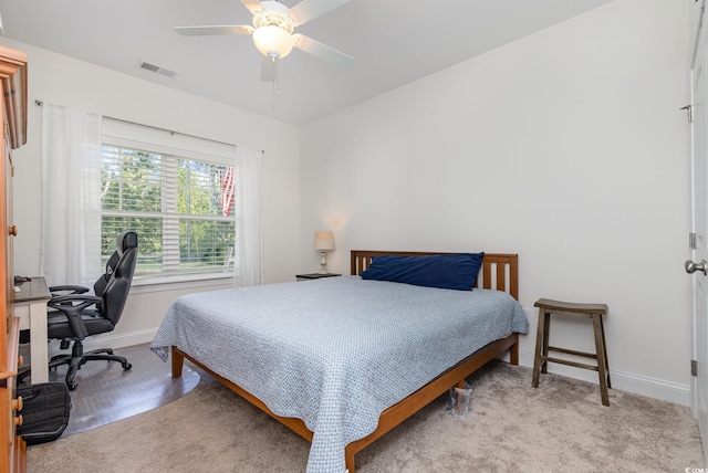 carpeted bedroom with ceiling fan