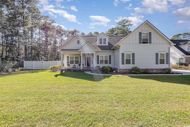 view of front of home featuring a porch and a front yard