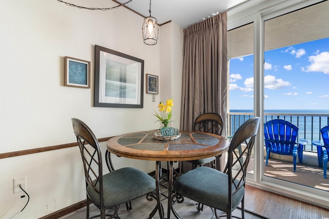 200 76th Ave N Unit 1106, Myrtle Beach, SC 29572 - dining space featuring wood finished floors, baseboards, and a water view