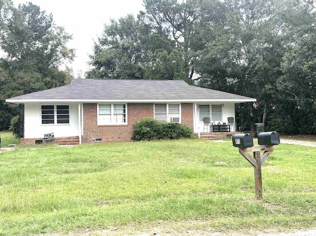 ranch-style house featuring a front lawn