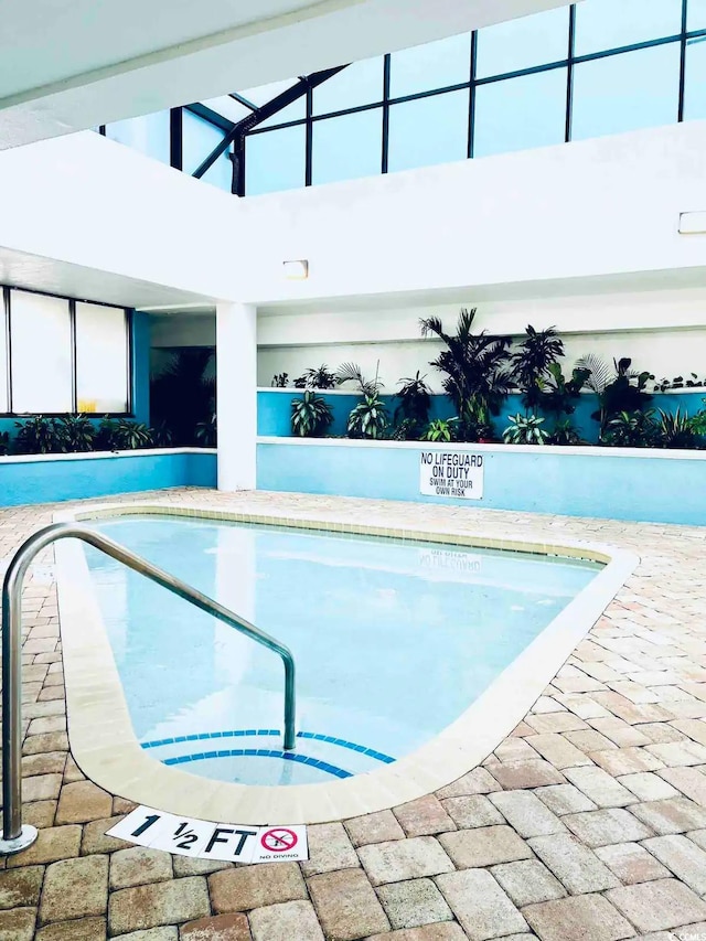 view of pool featuring a patio area