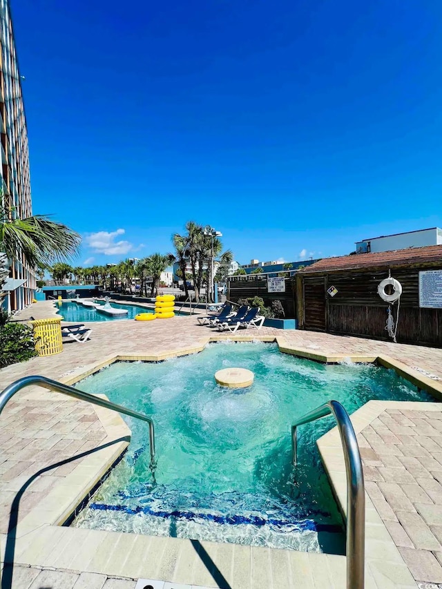 view of swimming pool featuring a patio