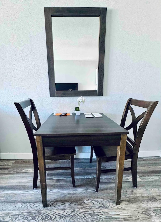 dining space featuring hardwood / wood-style flooring