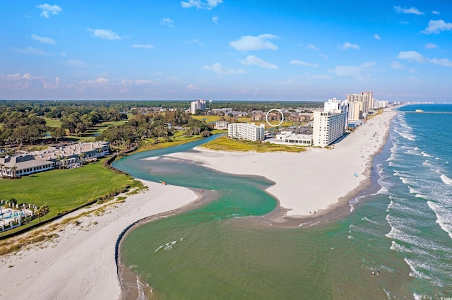 birds eye view of property featuring a beach view and a water view