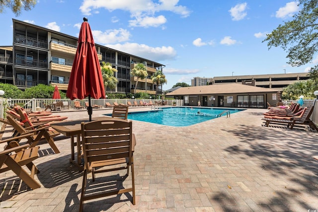 view of pool featuring a patio