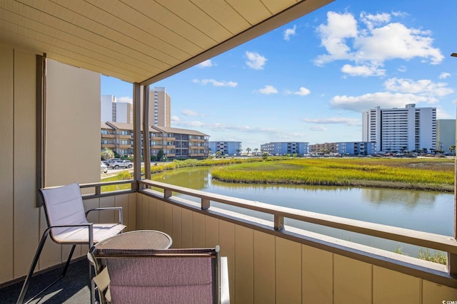 balcony featuring a water view