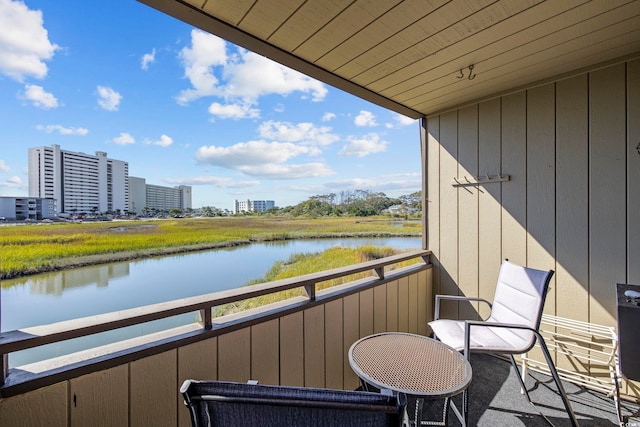 balcony featuring a water view