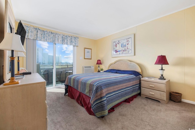 carpeted bedroom featuring access to exterior and a wall mounted air conditioner