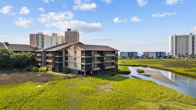 view of building exterior featuring a water view