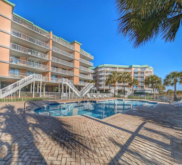 view of pool featuring a patio