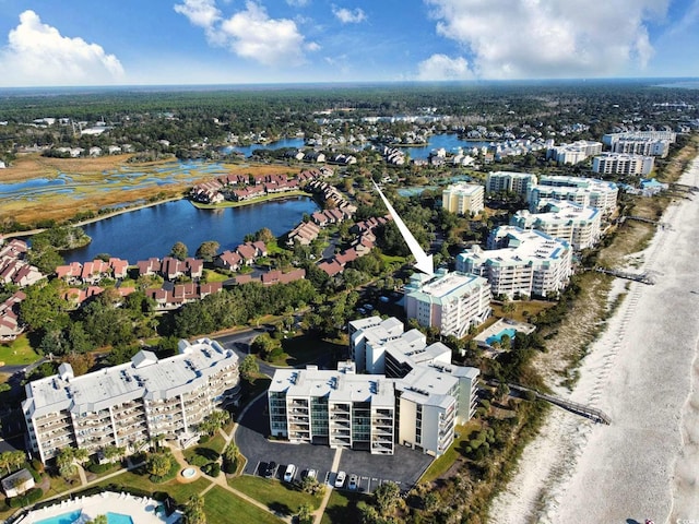 birds eye view of property with a water view