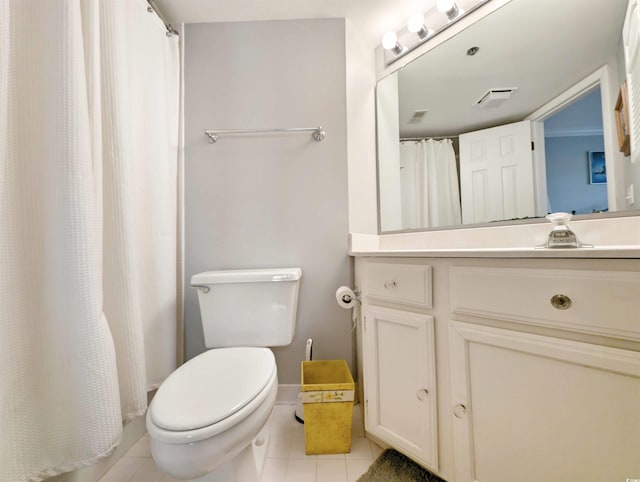 bathroom with tile patterned flooring, walk in shower, vanity, and toilet