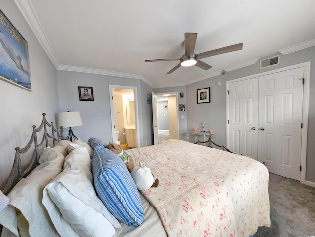 carpeted bedroom with ceiling fan, ensuite bathroom, a closet, and ornamental molding