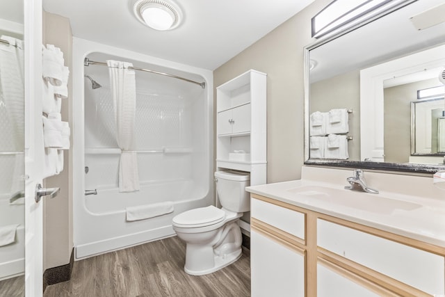 full bathroom featuring vanity, shower / tub combo, wood-type flooring, and toilet