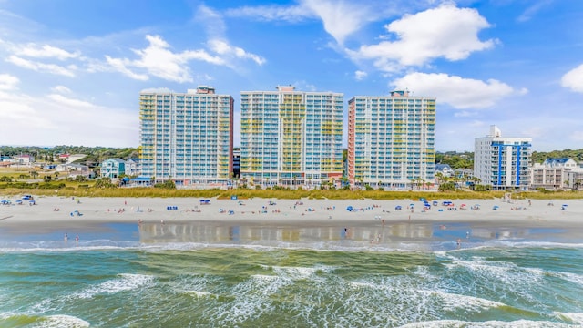 bird's eye view with a water view and a view of the beach