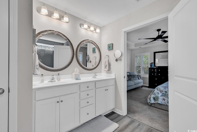 bathroom with vanity, hardwood / wood-style flooring, and ceiling fan