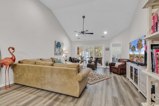 living room with high vaulted ceiling, light wood-type flooring, and ceiling fan