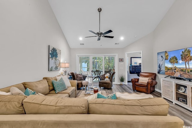 living room with high vaulted ceiling, hardwood / wood-style flooring, and ceiling fan