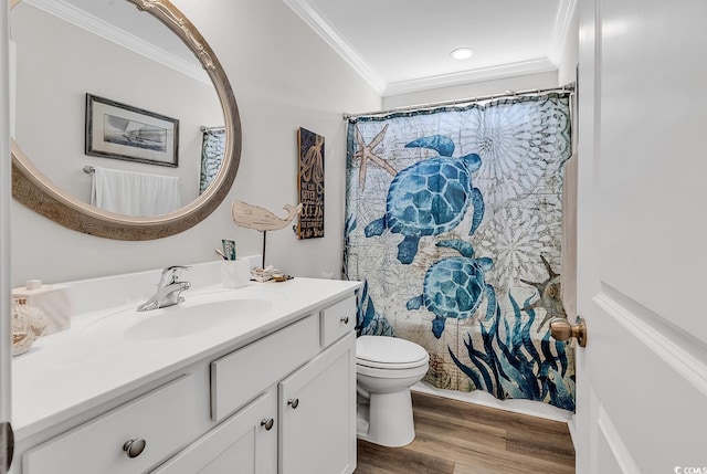 bathroom featuring toilet, a shower with curtain, ornamental molding, hardwood / wood-style floors, and vanity