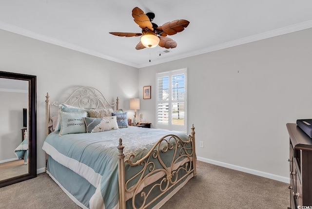 carpeted bedroom with ornamental molding and ceiling fan