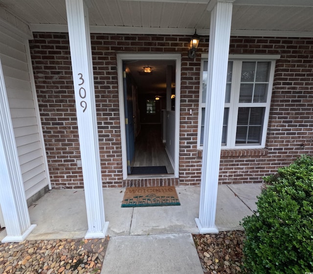 property entrance featuring covered porch