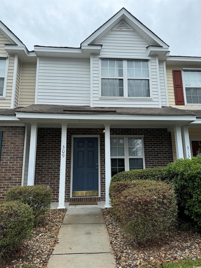 view of front of property featuring covered porch