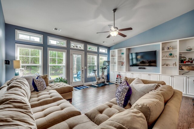 living room with ceiling fan, vaulted ceiling, and dark hardwood / wood-style floors