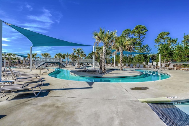 view of swimming pool featuring a patio area