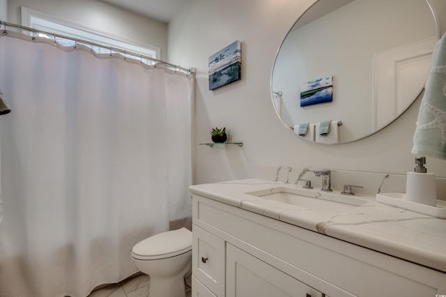 bathroom featuring walk in shower, vanity, and toilet