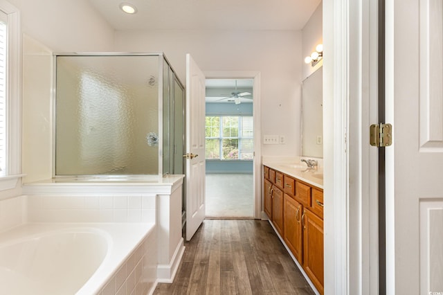 bathroom featuring wood-type flooring, vanity, separate shower and tub, and ceiling fan